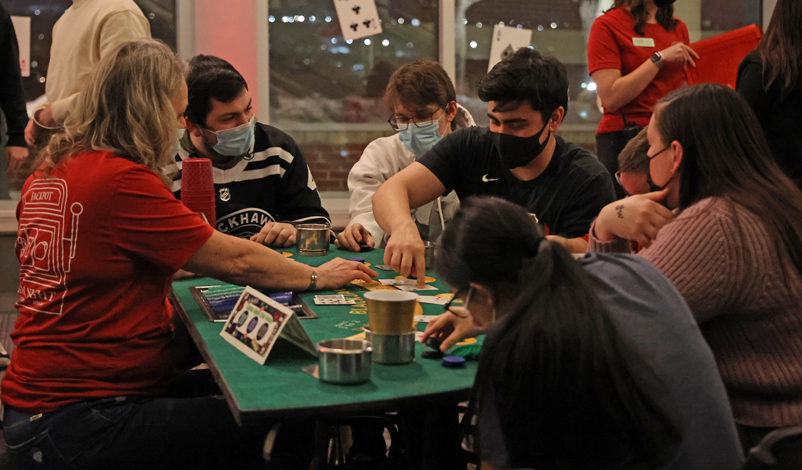 Students playing at a card table