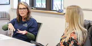 Two professionals discussing strategy