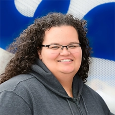 Katie Kielkucki Smiles into the camera.