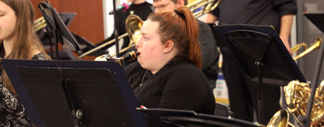 Jazz band student playing an instrument.