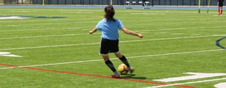 soccer ball being pushed around by kids