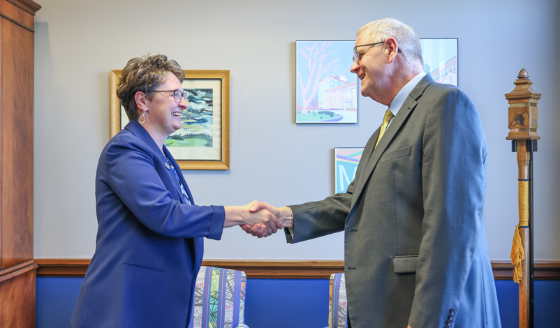 Presidents Novak and Olson shaking hands