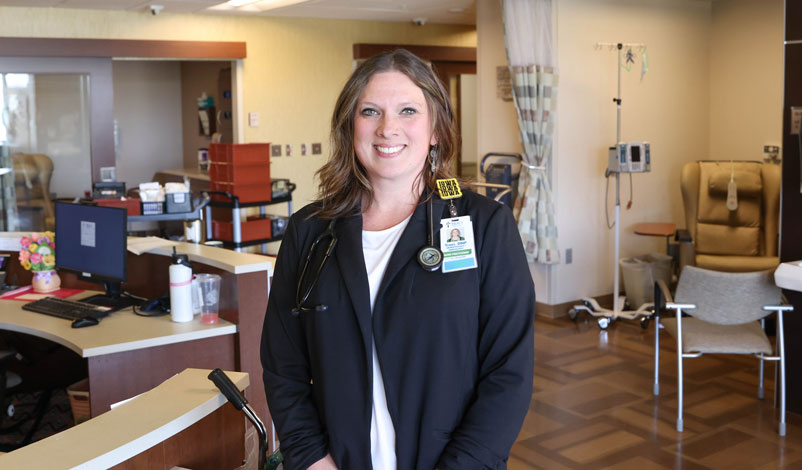 MMU alumni traci ridgeway posing in Hall-Perrine Cancer Center